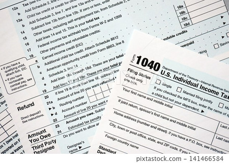 1040 US individual income tax return form blank close up. Few pages of united states tax blank 1040 US individual income tax return form blank close up. Few pages of united states tax blank 141466584