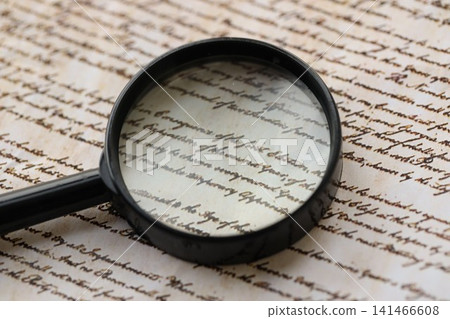 American USA Constitution paper page and magnifying glass close up American USA Constitution paper page and magnifying glass close up 141466608