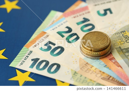 European union money currency Euro different paper notes and coins on flag European union money currency Euro different paper notes and coins on flag 141466611