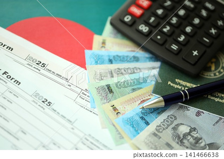 Bangladeshi taka money bills lies on table with pen, calculator, passport and tax forms Bangladeshi taka money bills lies on table with pen, calculator, passport and tax forms 141466638