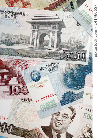 North Korean won money bills in big amount lies on white color table close up 141466657