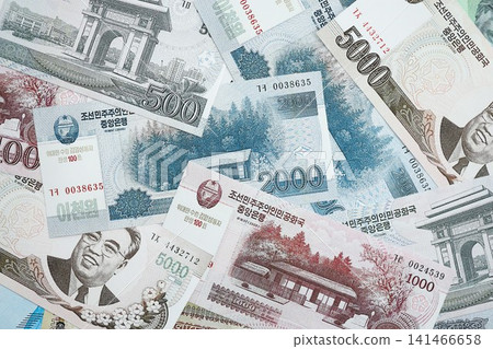 North Korean won money bills in big amount lies on white color table close up 141466658