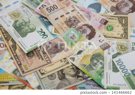 Big amount of money bills of different currencies and countries. Assortment background Big amount of money bills of different currencies and countries. Assortment background 141466662