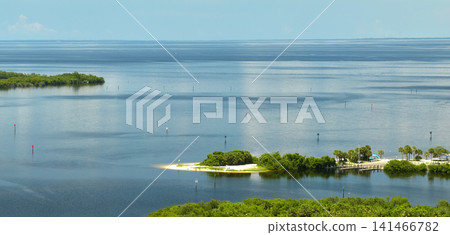 Overhead view of Everglades swamp with green vegetation between water inlets. Natural habitat of many tropical species in Florida wetlands Overhead view of Everglades swamp with green vegetation between water inlets. Natural habitat of many tropical species in Florida wetlands 141466782