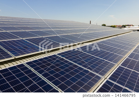 Office building with solar roof. Blue photovoltaic panels for producing clean ecological electric energy. Investing in renewable electricity concept Office building with solar roof. Blue photovoltaic panels for producing clean ecological electric energy. Investing in renewable electricity concept 141466795