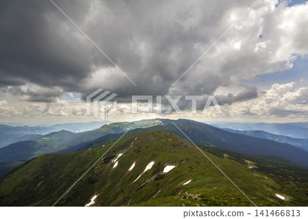Mountain ridge landscape under dramatic cloudy sky, summer or spring wide panoramic view. Mountain ridge landscape under dramatic cloudy sky, summer or spring wide panoramic view. 141466813