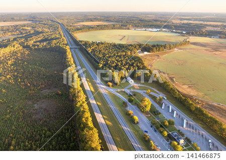 Large truck stop rest area on interstate freeway for trucks overnight parking. Recreational place during long traveling Large truck stop rest area on interstate freeway for trucks overnight parking. Recreational place during long traveling 141466875