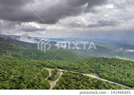 Landscape of Beacon Heights parking lot overlook on Blue Ridge Parkway in summer season. Mountain pass road in North Carolina Appalachian mountains, USA Landscape of Beacon Heights parking lot overlook on Blue Ridge Parkway in summer season. Mountain pass road in North Carolina Appalachian mountains, USA 141466891