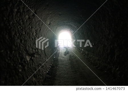 Light shines through the dark tunnel at the end of the Horikiri Tunnel. Light shines through the dark tunnel at the end of the Horikiri Tunnel. 141467073