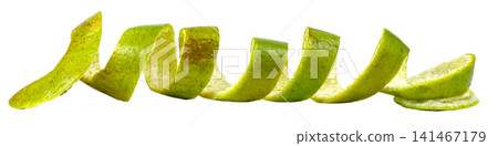 Long spiraled lime or green citrus fruit peel isolated. Fresh organic zest twist showing textured skin and white pith. Ideal for food, drink, cocktail, and nutrition concepts. Long spiraled lime or green citrus fruit peel isolated. Fresh organic zest twist showing textured skin and white pith. Ideal for food, drink, cocktail, and nutrition concepts. 141467179