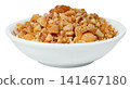 White ceramic bowl filled with crushed roasted peanuts isolated. Close-up of crunchy nut pieces, perfect for food topping or snack ingredient. High-quality studio shot. 141467180