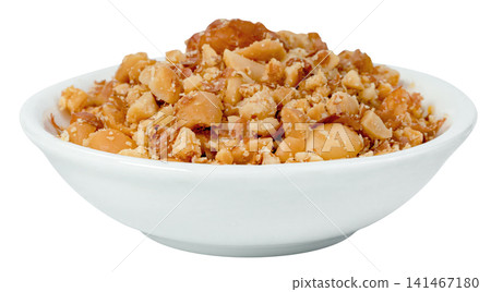 White ceramic bowl filled with crushed roasted peanuts isolated. Close-up of crunchy nut pieces, perfect for food topping or snack ingredient. High-quality studio shot. White ceramic bowl filled with crushed roasted peanuts isolated. Close-up of crunchy nut pieces, perfect for food topping or snack ingredient. High-quality studio shot. 141467180