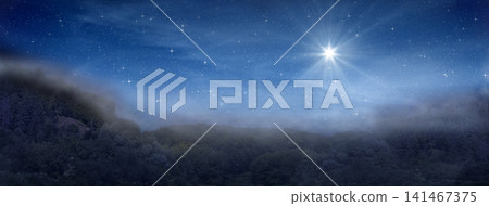 Bright star indicates the Nativity of Jesus Christ in the starry sky and fog rises in the mountains above the night forest. Bright star indicates the Nativity of Jesus Christ in the starry sky and fog rises in the mountains above the night forest. 141467375