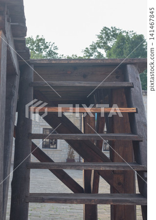 Rustic wooden staircase of a medieval fortress or watchtower Rustic wooden staircase of a medieval fortress or watchtower 141467845