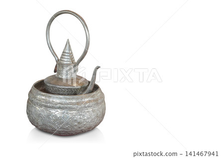 closeup antique silver kettle placed in a antique silver bowl on white background, object, decor, fashion, collection, ancient, old, copy space closeup antique silver kettle placed in a antique silver bowl on white background, object, decor, fashion, collection, ancient, old, copy space 141467941