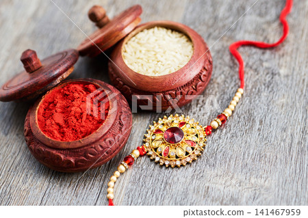 Raksha bandhan rakhi with sindoor and rice grains Raksha bandhan rakhi with sindoor and rice grains 141467959
