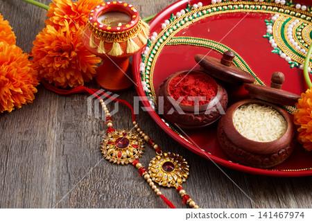 Raksha bandhan puja thali with rakhi, kumkum, rice Raksha bandhan puja thali with rakhi, kumkum, rice 141467974