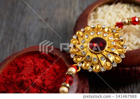 Rakhi with kumkum and rice for raksha bandhan Rakhi with kumkum and rice for raksha bandhan 141467988