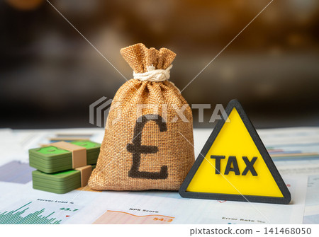 Symbol of attention to taxes and british pound money bag. Financial statements. Tax payment period. Symbol of attention to taxes and british pound money bag. Financial statements. Tax payment period. 141468050