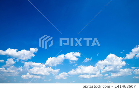 Blue sky background with a tiny clouds Blue sky background with a tiny clouds 141468607