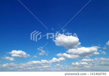 blue sky background with tiny clouds blue sky background with tiny clouds 141468793