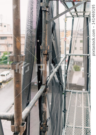 Metal scaffolding used for maintenance and management of apartment buildings Metal scaffolding used for maintenance and management of apartment buildings 141469195