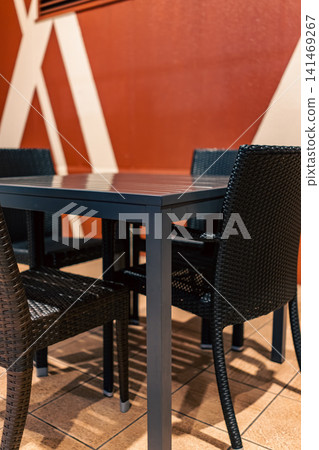 A seating area in a cafe or restaurant that showcases chic interior design. A seating area in a cafe or restaurant that showcases chic interior design. 141469267