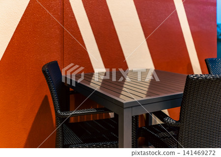 A seating area in a cafe or restaurant that showcases chic interior design. 141469272