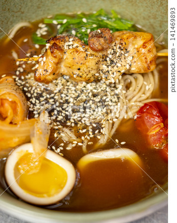 Asian dish. Miso soup. Colorful spaghetti with meat egg vegetable sesame spicy. Appetizing nutrition meal with cabbage tomato green seaweed. Asian dish. Miso soup. Colorful spaghetti with meat egg vegetable sesame spicy. Appetizing nutrition meal with cabbage tomato green seaweed. 141469893
