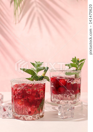 Mojito with sprite, mint and fresh berries,Detox water with raspberries, cherries, and currants, over ice. A refreshing summer homemade lemonade cocktail. Fruit juice and ingredients, Mojito with sprite, mint and fresh berries,Detox water with raspberries, cherries, and currants, over ice. A refreshing summer homemade lemonade cocktail. Fruit juice and ingredients, 141470620