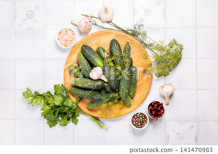 Fresh cucumbers ready for pickling with various spices Fresh cucumbers ready for pickling with various spices 141470983