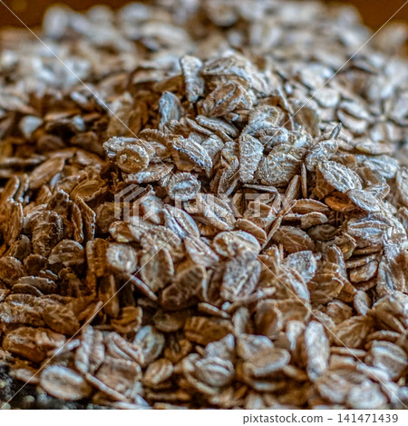 Close Up Texture of Natural Rolled Oats and Oat Flakes, Whole Grain Cereal Ingredient for Healthy Breakfast, Organic Food, Nutrition and Agricultural Food Background 141471439