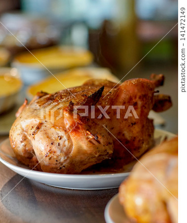 Whole Roasted Chicken on White Plate with Golden Crispy Skin, Homemade Oven Roasted Poultry, Gourmet Restaurant Main Course, Comfort Food for Family Dinner and Catering Whole Roasted Chicken on White Plate with Golden Crispy Skin, Homemade Oven Roasted Poultry, Gourmet Restaurant Main Course, Comfort Food for Family Dinner and Catering 141472149