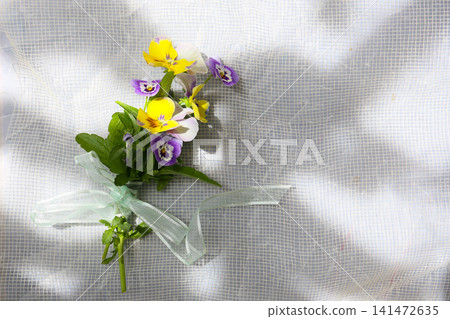 A small bouquet of pansy flowers A small bouquet of pansy flowers 141472635