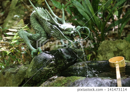 A water basin with a dragon motif and pure spring water at a shrine. A water basin with a dragon motif and pure spring water at a shrine. 141473114