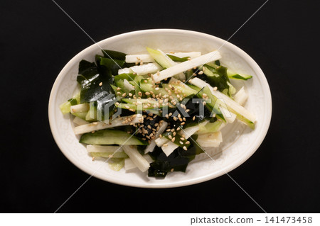 Nagaimo (Japanese yam), cucumber, wakame seaweed, salad Nagaimo (Japanese yam), cucumber, wakame seaweed, salad 141473458