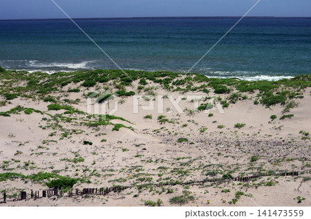 The summer sea. The vast, crystal-clear sky and the Pacific Ocean. The only sound is the lapping of the waves. A moment of pure bliss. The summer sea. The vast, crystal-clear sky and the Pacific Ocean. The only sound is the lapping of the waves. A moment of pure bliss. 141473559