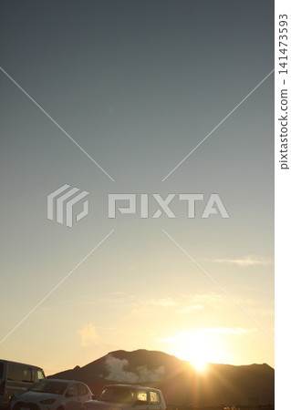 A monument commemorating Emperor Showa's visit to Kusasenrigahama Beach, located at the Kusasenrigahama Observatory in Aso City, Kumamoto Prefecture, and the sunrise over Kusasenrigahama Beach illuminated by the rising sun. A monument commemorating Emperor Showa's visit to Kusasenrigahama Beach, located at the Kusasenrigahama Observatory in Aso City, Kumamoto Prefecture, and the sunrise over Kusasenrigahama Beach illuminated by the rising sun. 141473593