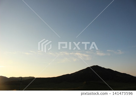 A monument commemorating Emperor Showa's visit to Kusasenrigahama Beach, located at the Kusasenrigahama Observatory in Aso City, Kumamoto Prefecture, and the sunrise over Kusasenrigahama Beach illuminated by the rising sun. A monument commemorating Emperor Showa's visit to Kusasenrigahama Beach, located at the Kusasenrigahama Observatory in Aso City, Kumamoto Prefecture, and the sunrise over Kusasenrigahama Beach illuminated by the rising sun. 141473596