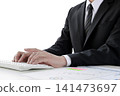 Hands of a businessman doing desk work using a computer 141473697