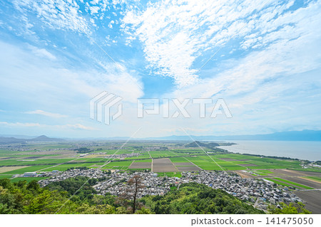 A magnificent panoramic view of Lake Biwa under a clear blue sky and clouds. 141475050