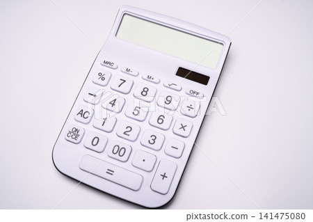 A still-life photograph of a calculator, representing accounting work with a white background. A still-life photograph of a calculator, representing accounting work with a white background. 141475080