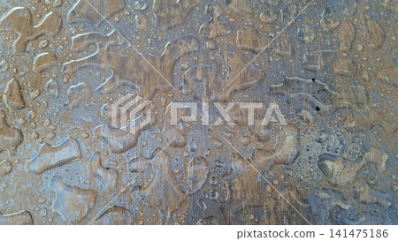 Water Drops Texture on Clear Plastic Cover Over Wooden Table Water Drops Texture on Clear Plastic Cover Over Wooden Table 141475186