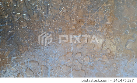 Water Droplets and Condensation on Transparent Table Cover Water Droplets and Condensation on Transparent Table Cover 141475187