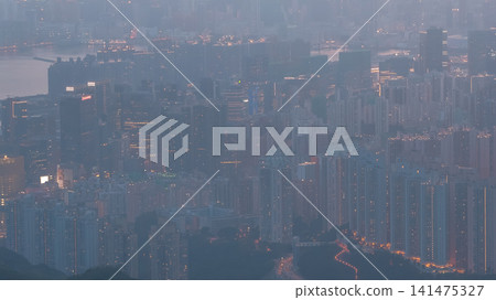 Hong Kong. July 26 2026 hazy Kowloon cityscape at dusk. Hong Kong. July 26 2026 hazy Kowloon cityscape at dusk. 141475327