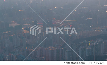 Hong Kong. July 26 2026 hazy Kowloon cityscape at dusk. Hong Kong. July 26 2026 hazy Kowloon cityscape at dusk. 141475328