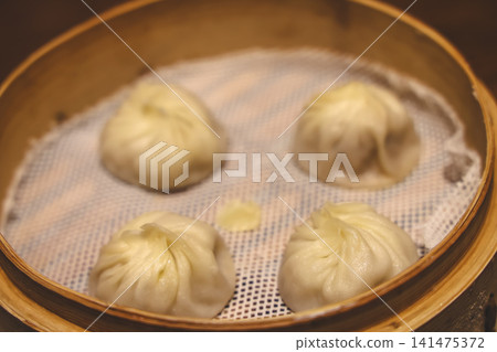 April 30 2026 Steamed dumplings served in bamboo basket April 30 2026 Steamed dumplings served in bamboo basket 141475372