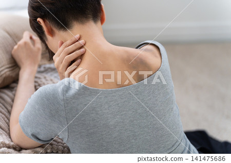 A woman with bruises on her back from domestic violence (special effects makeup) A woman with bruises on her back from domestic violence (special effects makeup) 141475686