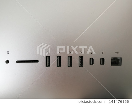 Row of USB and Thunderbolt ports on the back panel of an computer. Row of USB and Thunderbolt ports on the back panel of an computer. 141476166