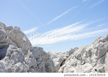 The landscape of towering white limestone rock formations and the blue sea in Shirasaki Marine Park. The landscape of towering white limestone rock formations and the blue sea in Shirasaki Marine Park. 141476459